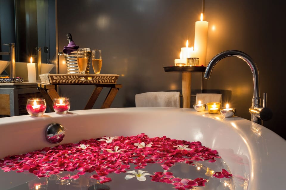 Suite, 1 King Bed | Bathroom | Rainfall showerhead, free toiletries, hair dryer, bathrobes