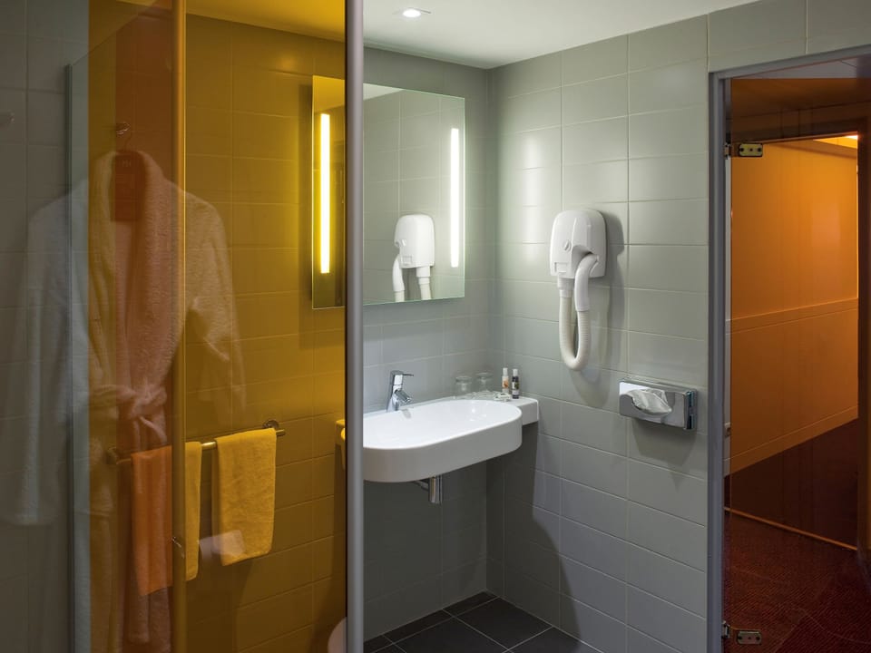 Eco-friendly toiletries, hair dryer, towels