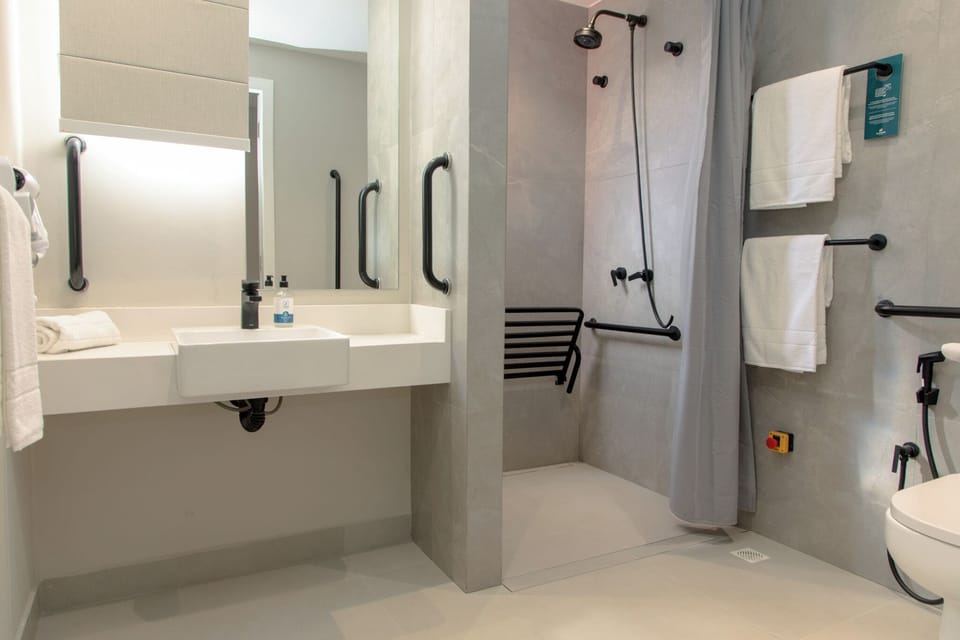 Deluxe Double or Twin Room, 1 Double or 2 Twin Beds, Mobility Accessible | Bathroom | Shower, free toiletries, hair dryer, towels