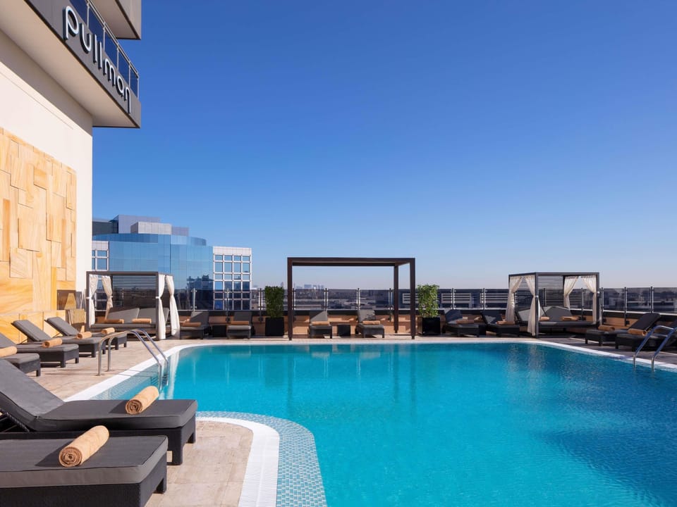 Outdoor pool, open 10:00 AM to 6:00 PM, free cabanas, pool umbrellas