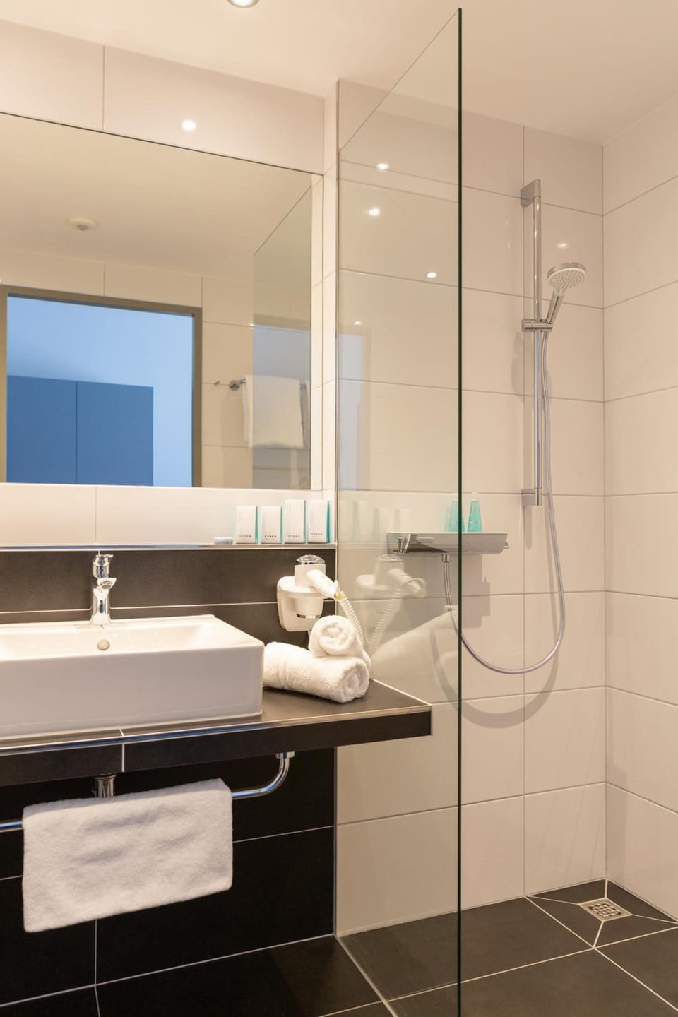 Shower, free toiletries, hair dryer, slippers