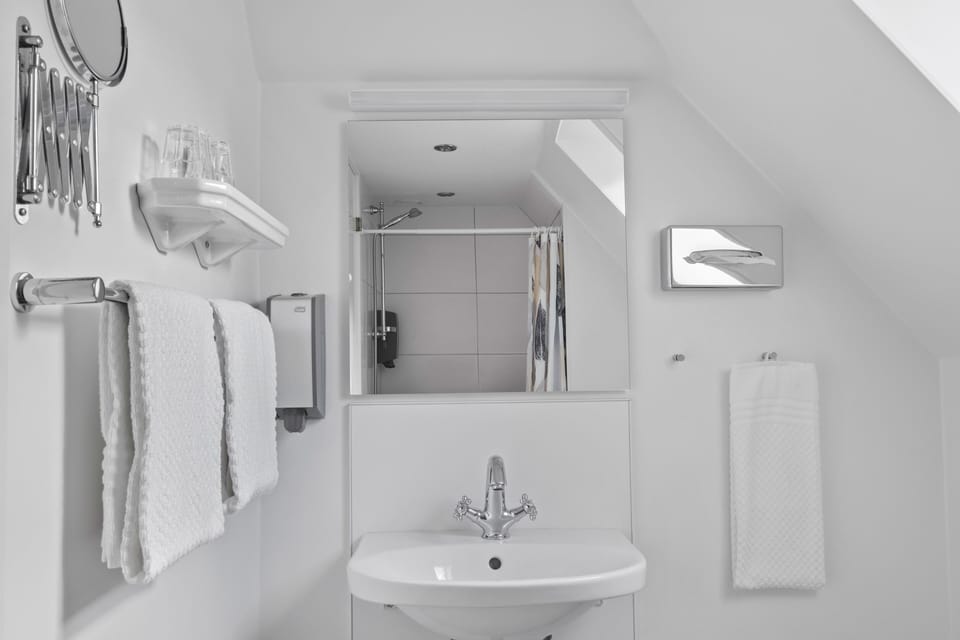 Junior Suite | Bathroom | Designer toiletries, hair dryer, towels, soap