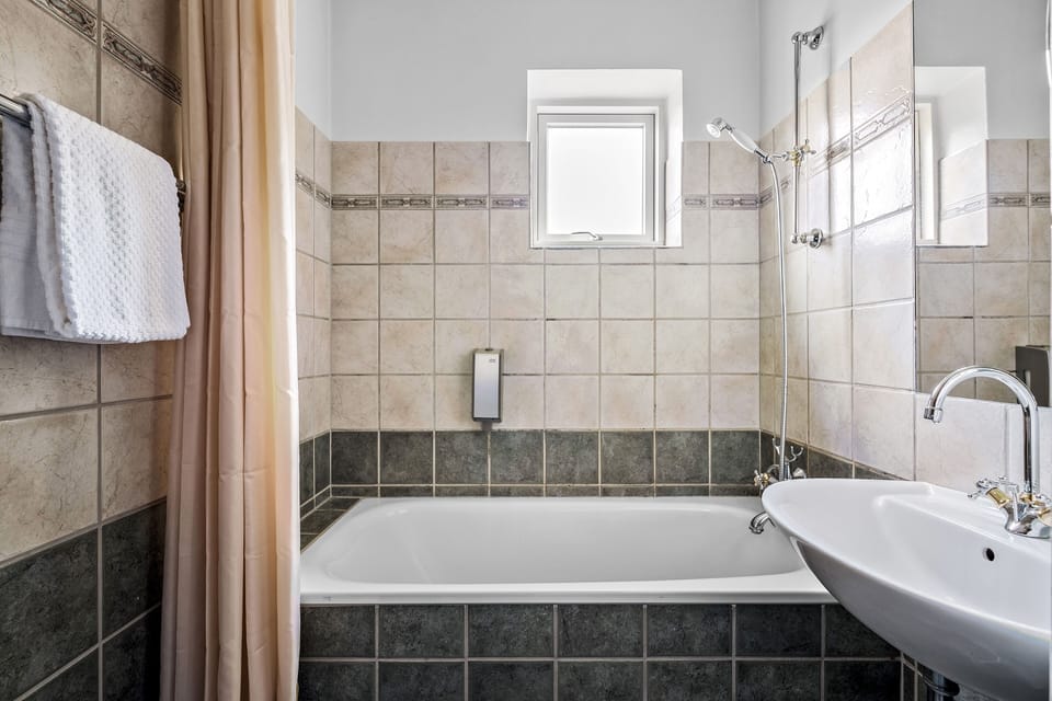 Junior Suite | Bathroom | Designer toiletries, hair dryer, towels, soap