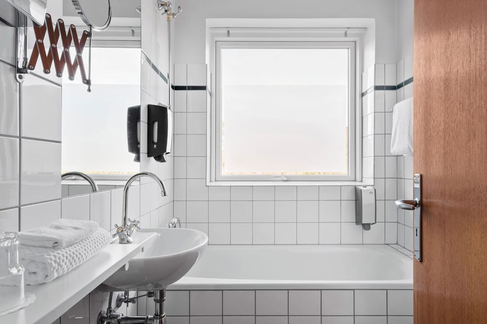 Single Room | Bathroom | Designer toiletries, hair dryer, towels, soap