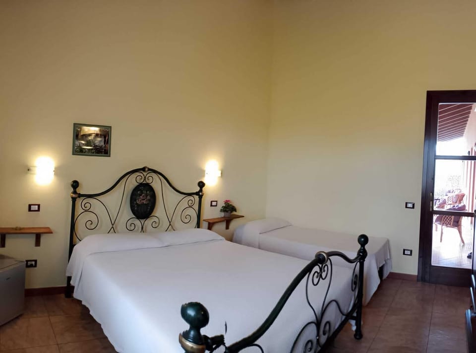 Standard Triple Room, Garden View | Down comforters, desk, laptop workspace, blackout drapes