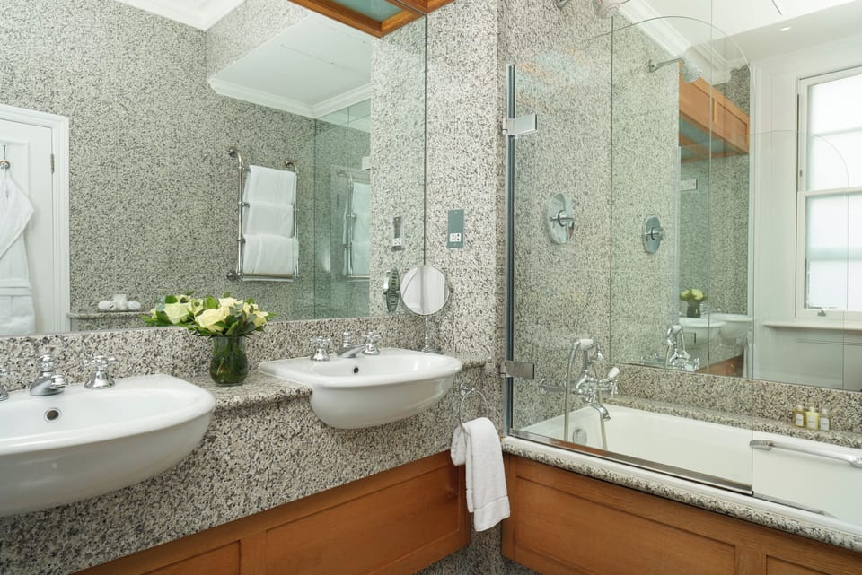 Combined shower/tub, designer toiletries, hair dryer, bathrobes