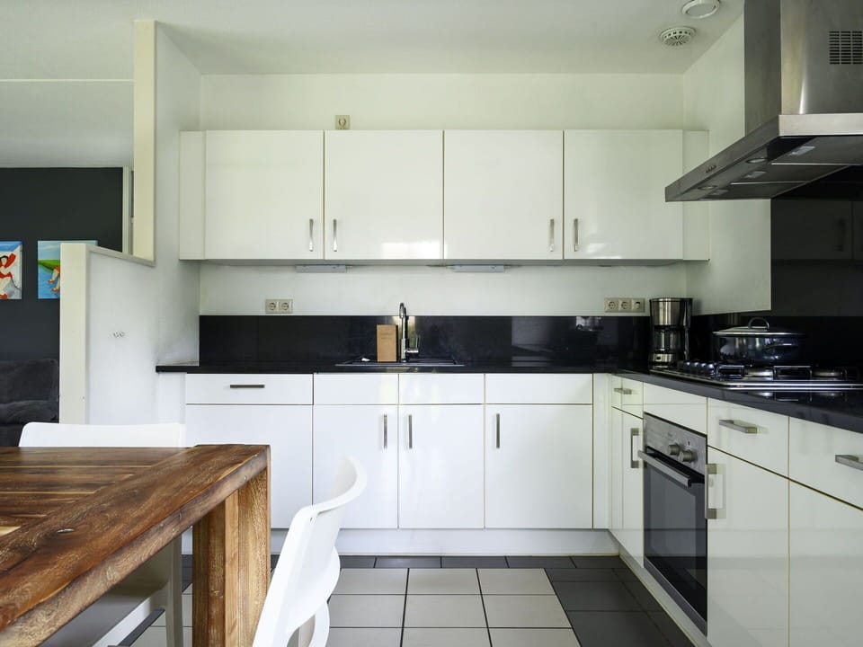 Cabinetry, Countertop, Property, Kitchen, Kitchen Appliance, Kitchen Stove, Wood, Interior Design, Flooring, Floor