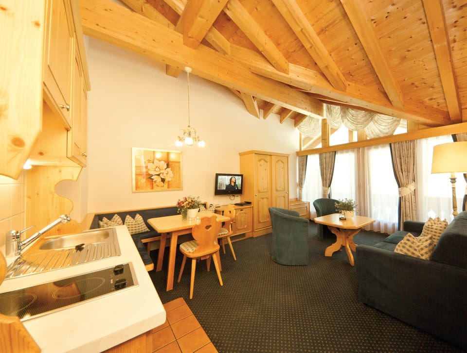 Superior Suite, 1 Bedroom, Balcony | Living area | TV