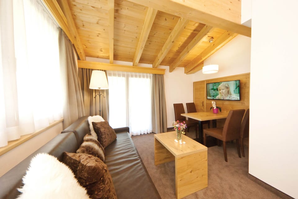Superior Suite, 1 Bedroom, Balcony | Living area | TV