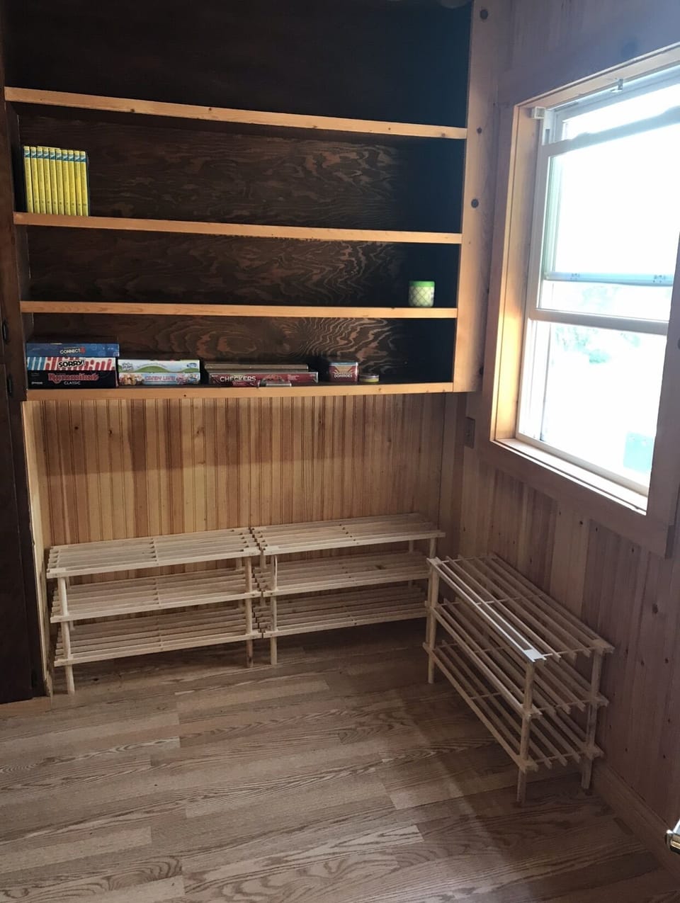 Entry way with shoe racks, games and books