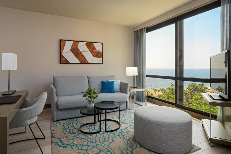 Room, 1 King Bed with Sofa bed, Sea View | Living room | 107-cm flat-screen TV with satellite channels, TV