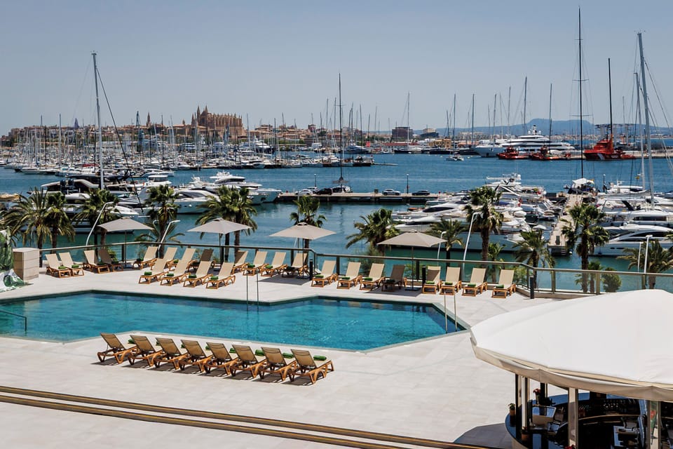Seasonal outdoor pool, open 10:00 AM to 6:00 PM, pool umbrellas