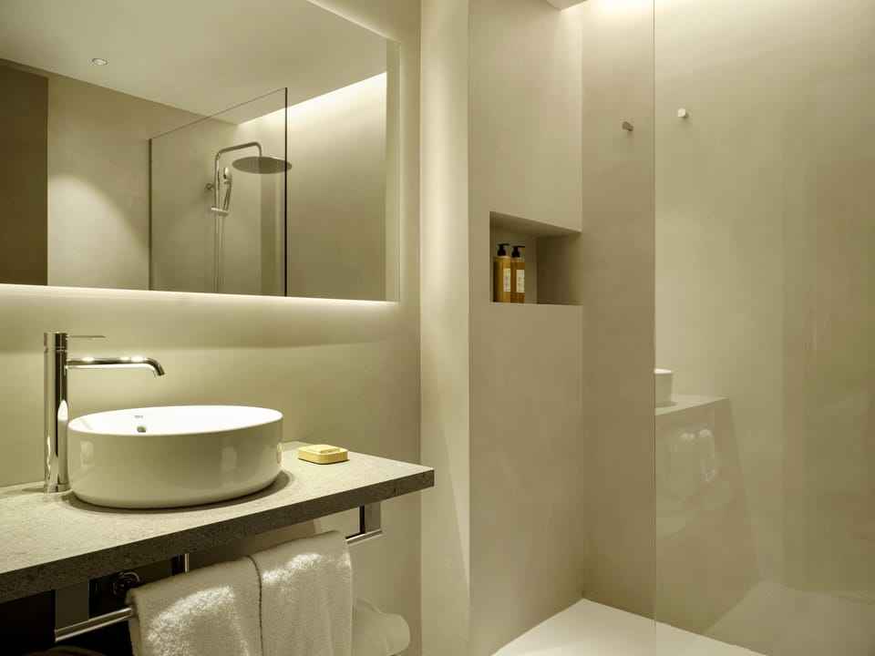 Deluxe Double Room | Bathroom | Shower, designer toiletries, hair dryer, slippers