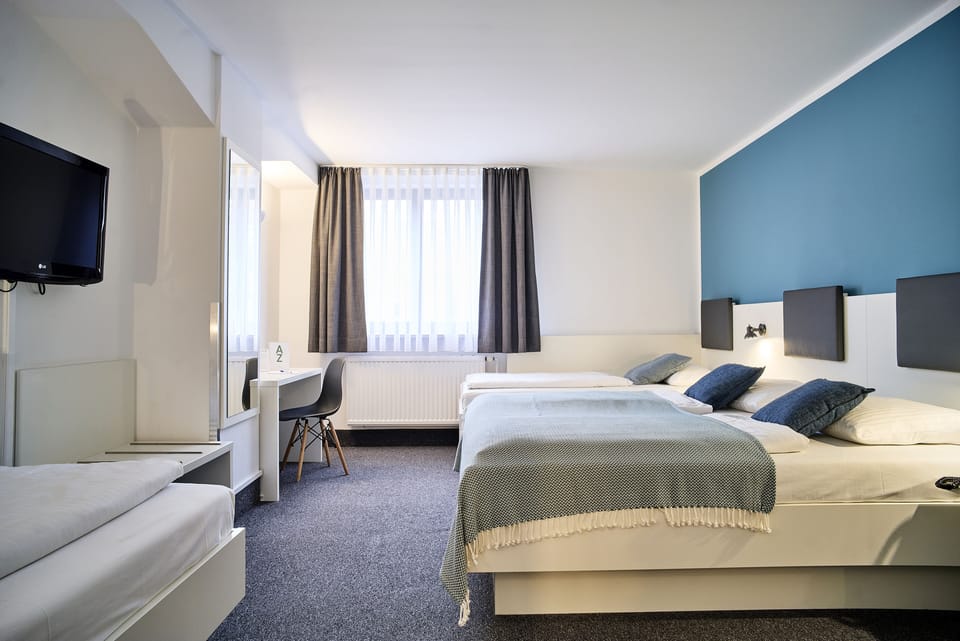 Quadruple Room, Courtyard | Hypo-allergenic bedding, desk, laptop workspace, blackout drapes