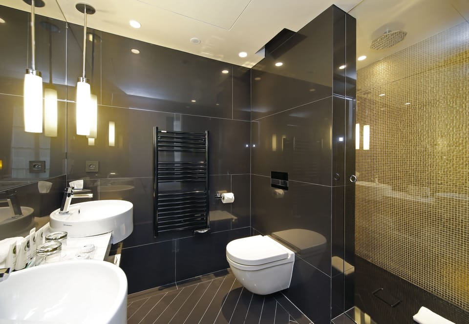 Designer toiletries, hair dryer, bathrobes, slippers