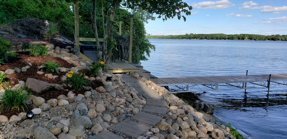 beautiful lake side deck, dock area. Bin full of things for guests to use.
