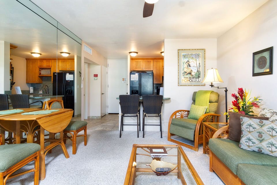Bright living space with a queen sofa bed, offering panoramic lagoon and ocean views for relaxation.