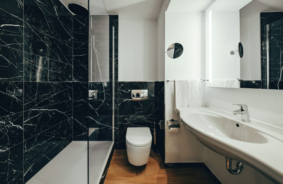 Comfort Room | Bathroom | Hair dryer, towels, soap, shampoo