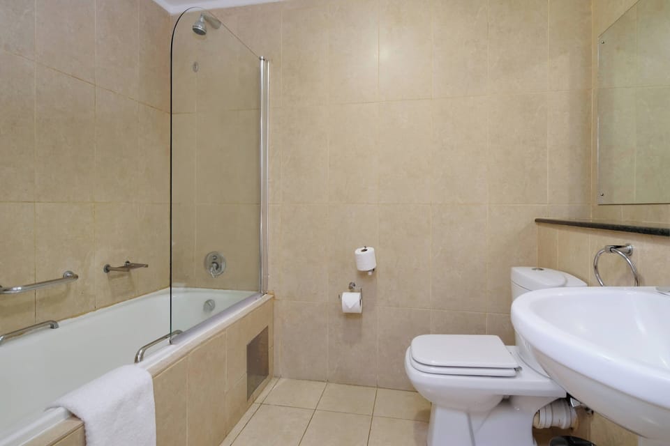 Room, 2 Double Beds | Bathroom | Combined shower/tub, free toiletries, hair dryer, bathrobes