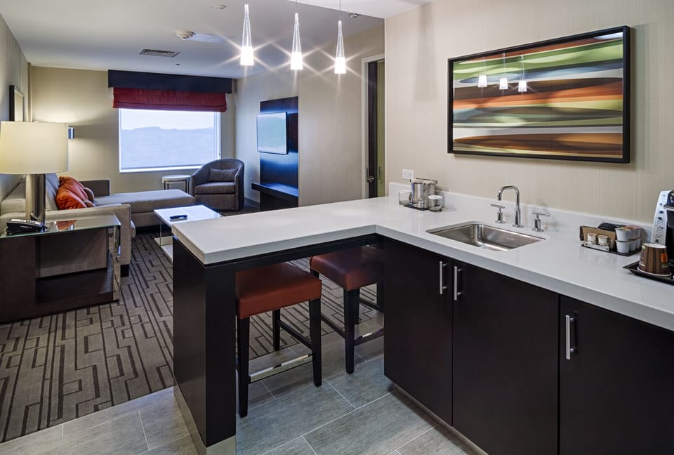 55-inch flat-screen TV with satellite channels, pay movies