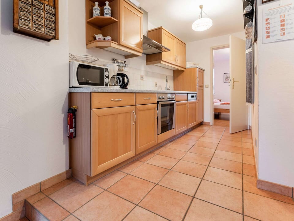Apartment | Private kitchen | Fridge, highchair