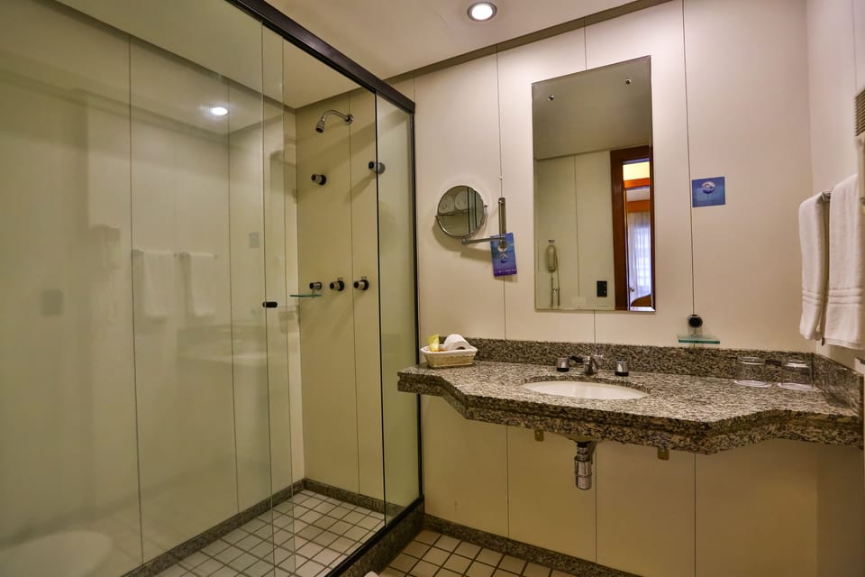 Standard Studio | Bathroom | Shower, rainfall showerhead, hair dryer, towels
