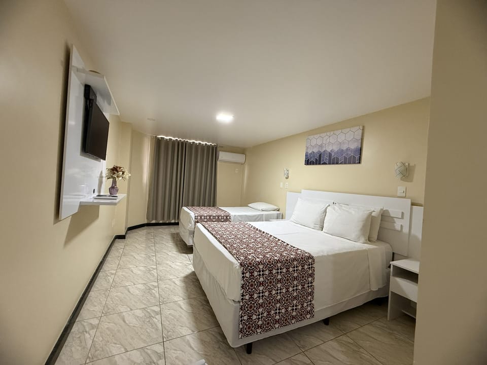 Standard Triple Room | Minibar, in-room safe, desk, free WiFi
