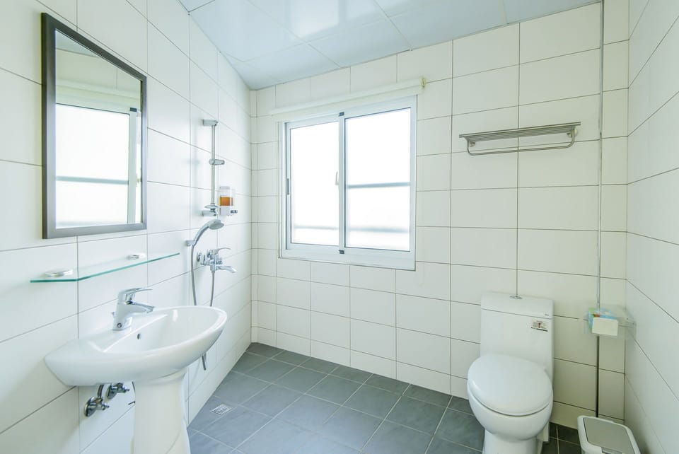 Basic Double Room, 1 King Bed | Bathroom | Shower, hair dryer, slippers, soap