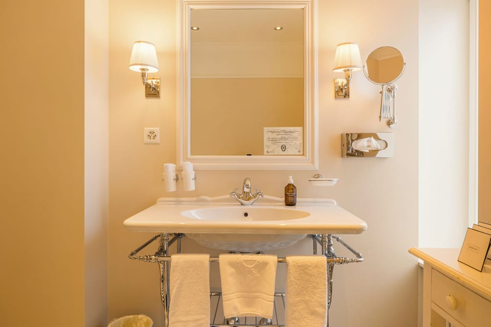 Suite | Bathroom | Designer toiletries, hair dryer, towels
