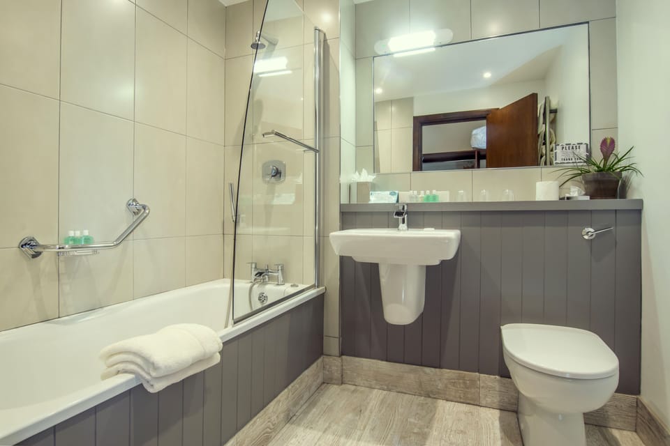 Designer toiletries, hair dryer, bathrobes, slippers
