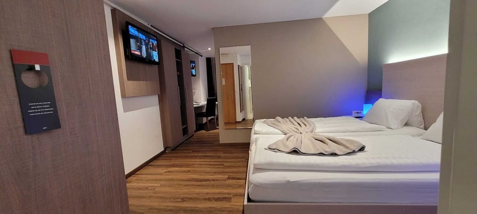 Economy Quadruple Room | Premium bedding, Select Comfort beds, in-room safe, desk