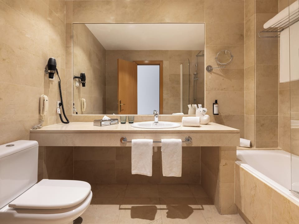 Hair dryer, towels, soap, shampoo