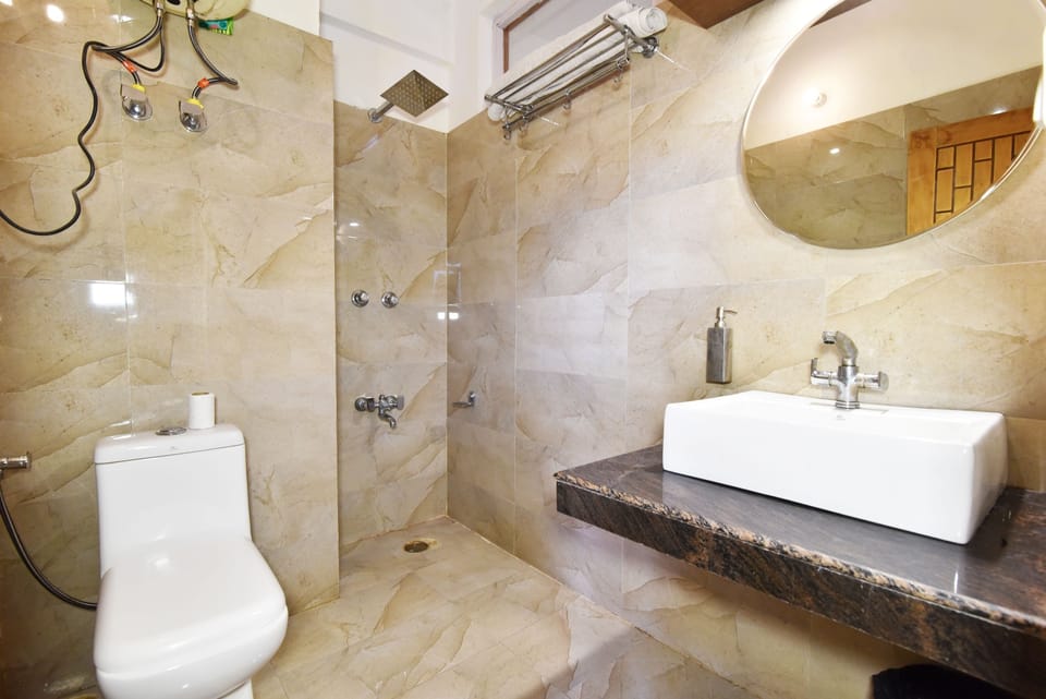 Deluxe Room, 1 King Bed | Bathroom | Separate tub and shower, deep soaking tub, rainfall showerhead