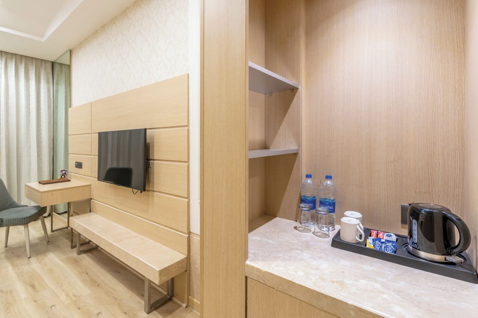 Standard Deluxe Room | Memory foam beds, in-room safe, desk, iron/ironing board (on request)