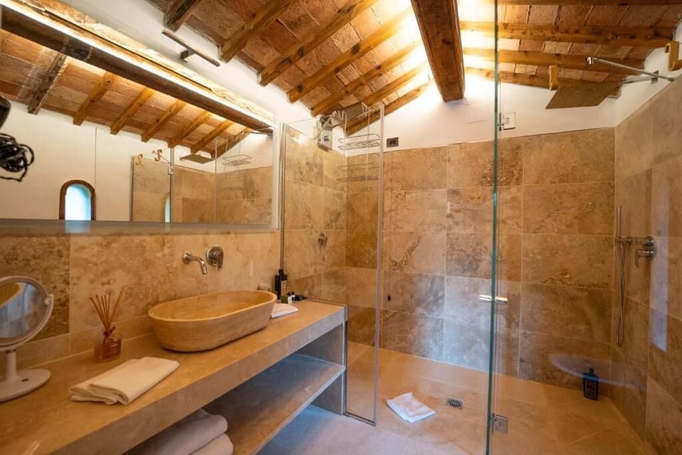 Suite Spa Bath | Bathroom | Bathtub, rainfall showerhead, hair dryer, slippers
