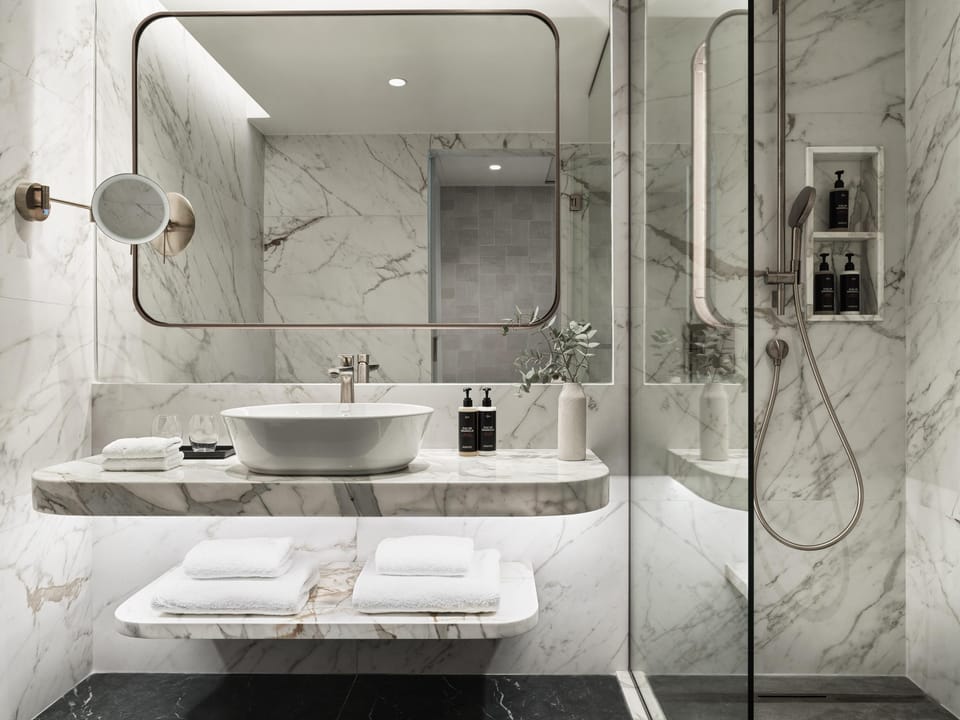 Designer toiletries, hair dryer, bathrobes, slippers