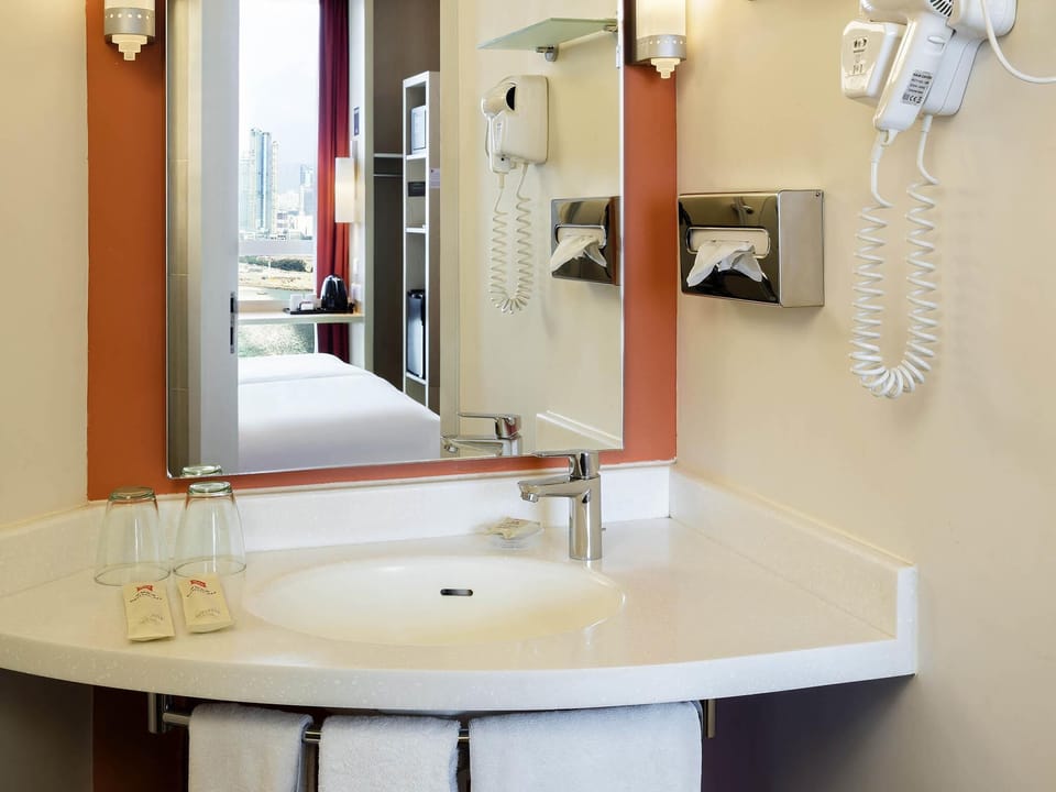 Shower, eco-friendly toiletries, hair dryer, towels