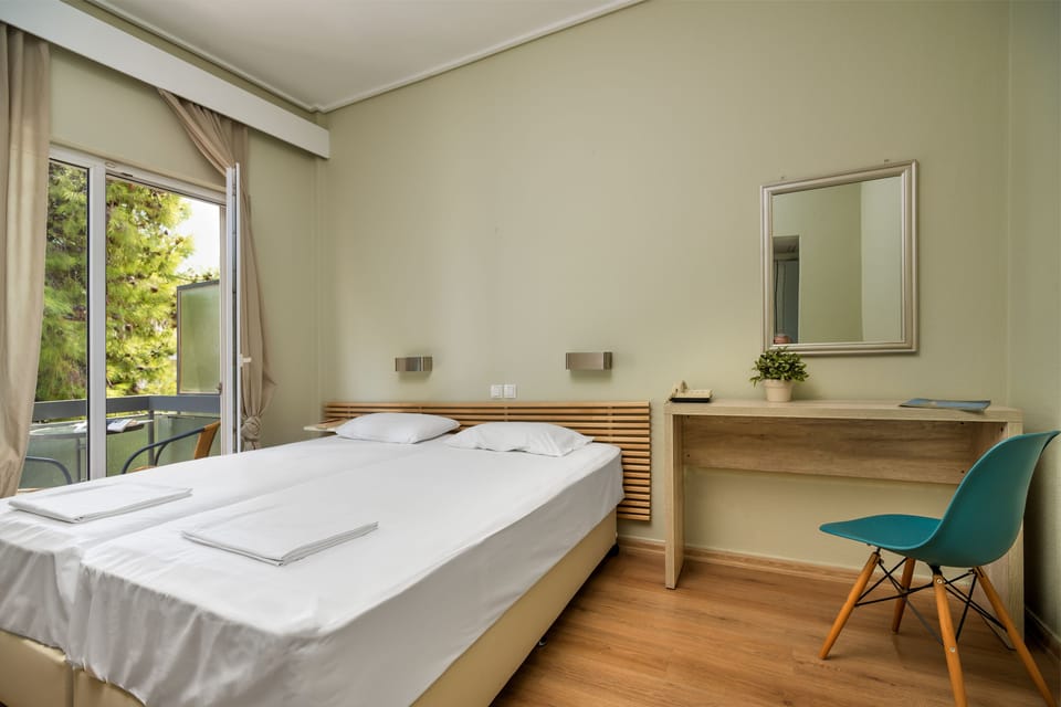 Double or Twin Room | Iron/ironing board, free cribs/infant beds, rollaway beds, free WiFi