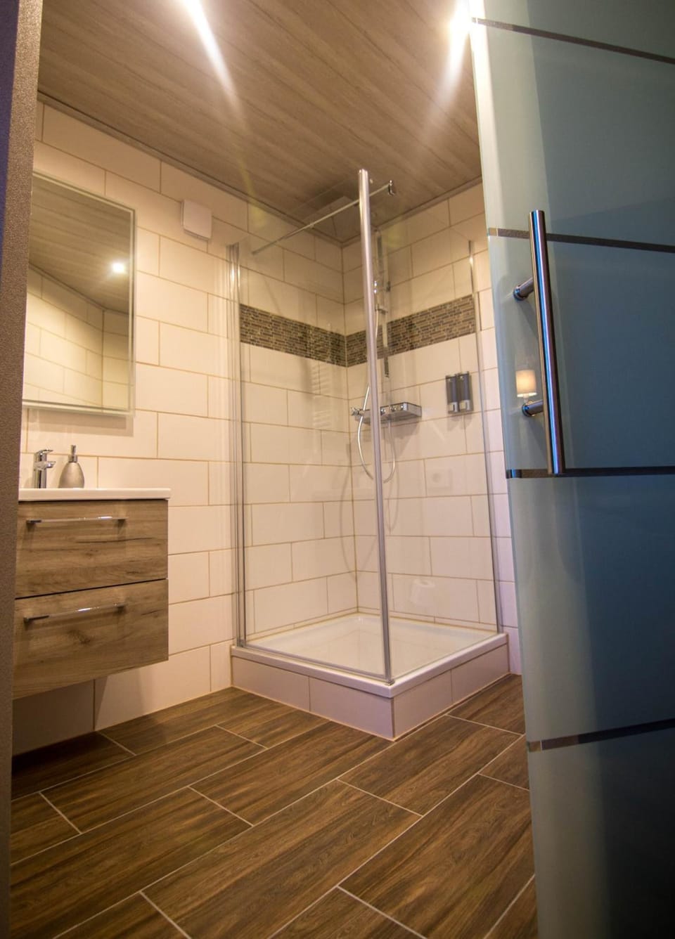 Shower, rainfall showerhead, hair dryer, towels