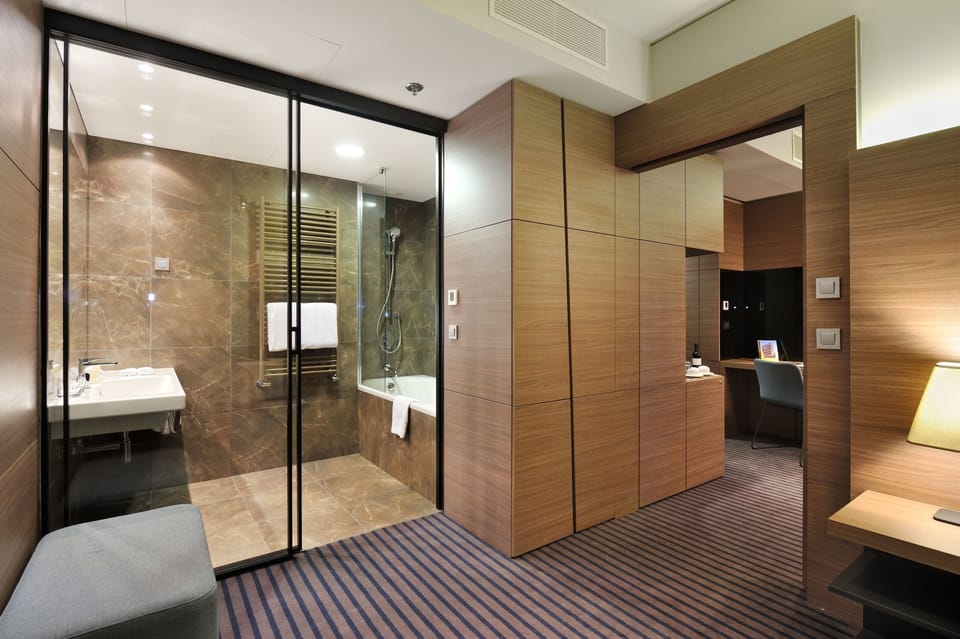 Junior Suite, 1 King Bed | Living area | TV