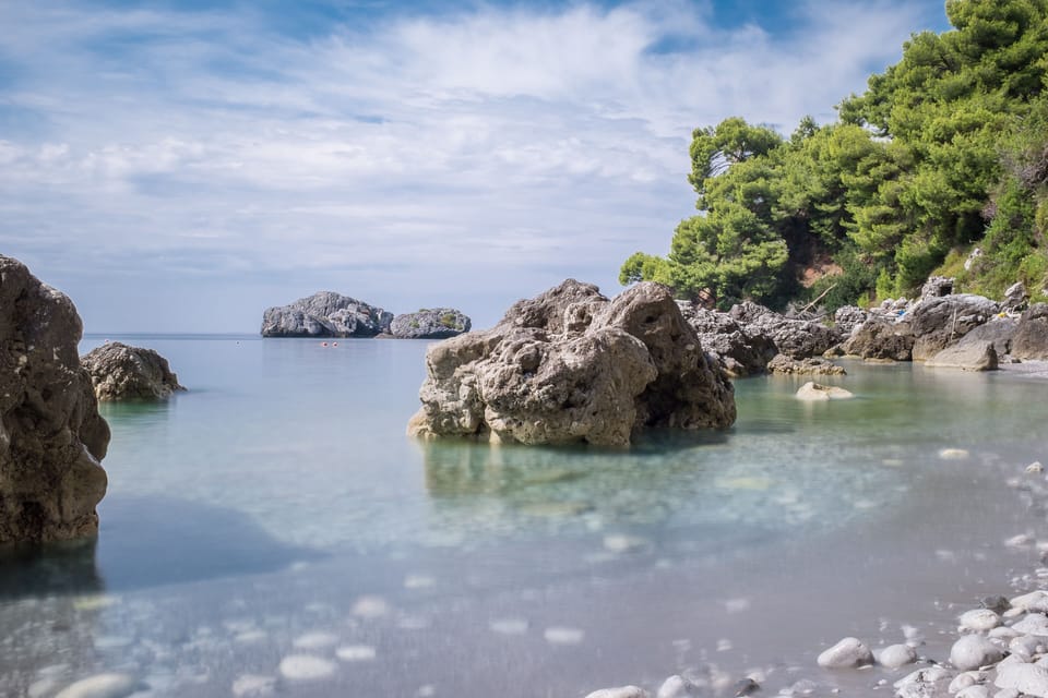 Private beach, black sand, free beach shuttle, sun loungers