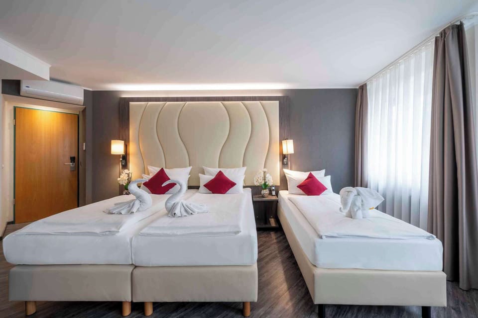 Premium Room, 3 Twin Beds (Cozy Sitting Corner) | Minibar, in-room safe, desk, blackout drapes