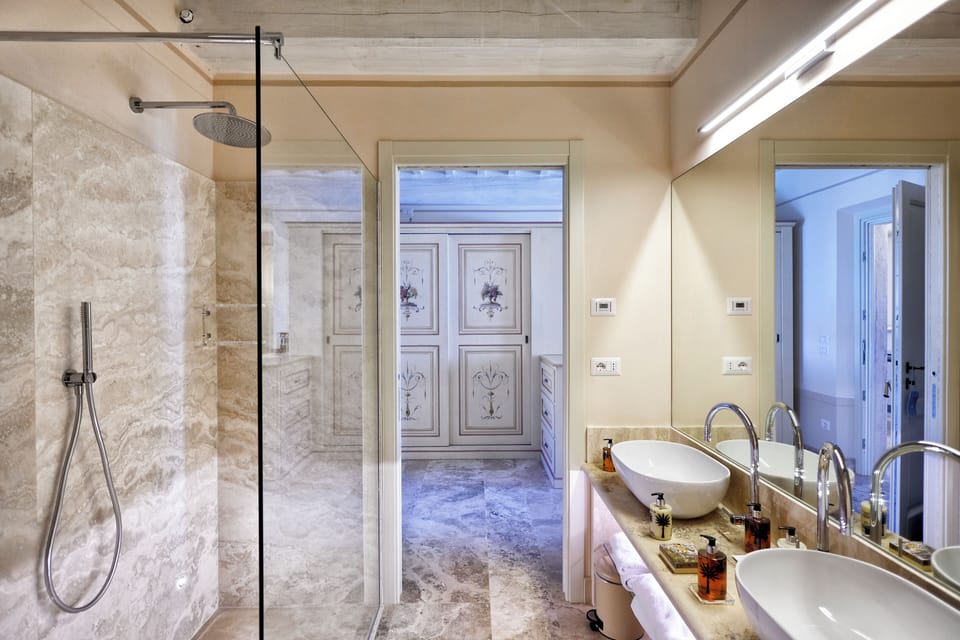 Suite | Bathroom | Hair dryer, bathrobes, slippers, towels