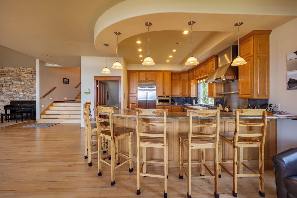Barstool seating around the kitchen- great hangout spot!
