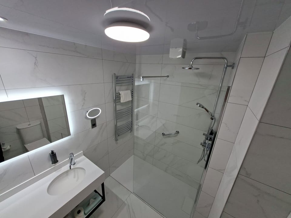 Shower, free toiletries, hair dryer, towels