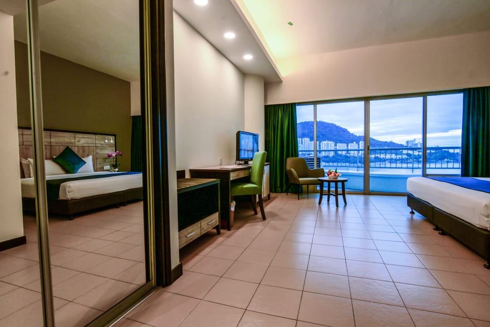 Deluxe Room, Sea View | Minibar, in-room safe, desk, free WiFi