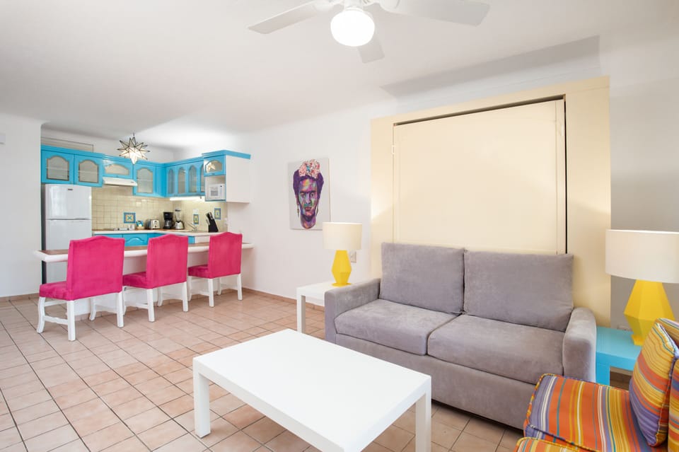 Suite, 2 Bedrooms | Living area | 32-inch TV with cable channels