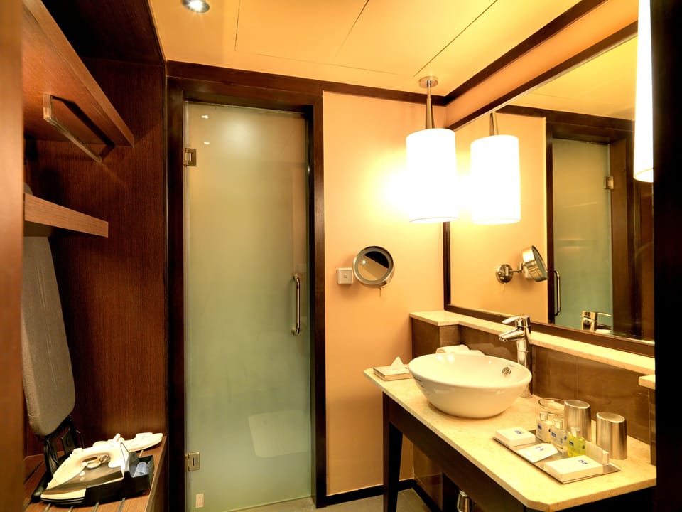 Shower, rainfall showerhead, designer toiletries, hair dryer