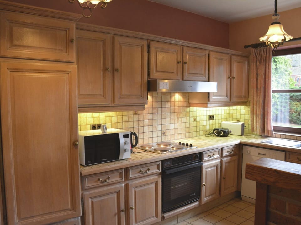 Villa | Private kitchen | Fridge, highchair