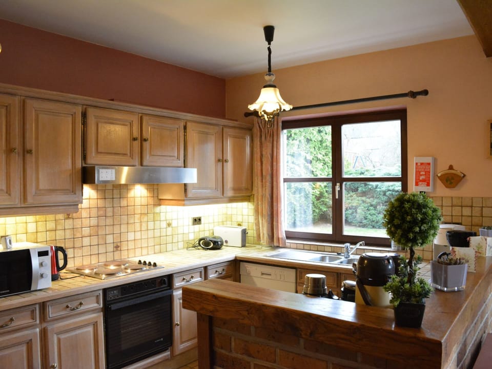 Villa | Private kitchen | Fridge, highchair